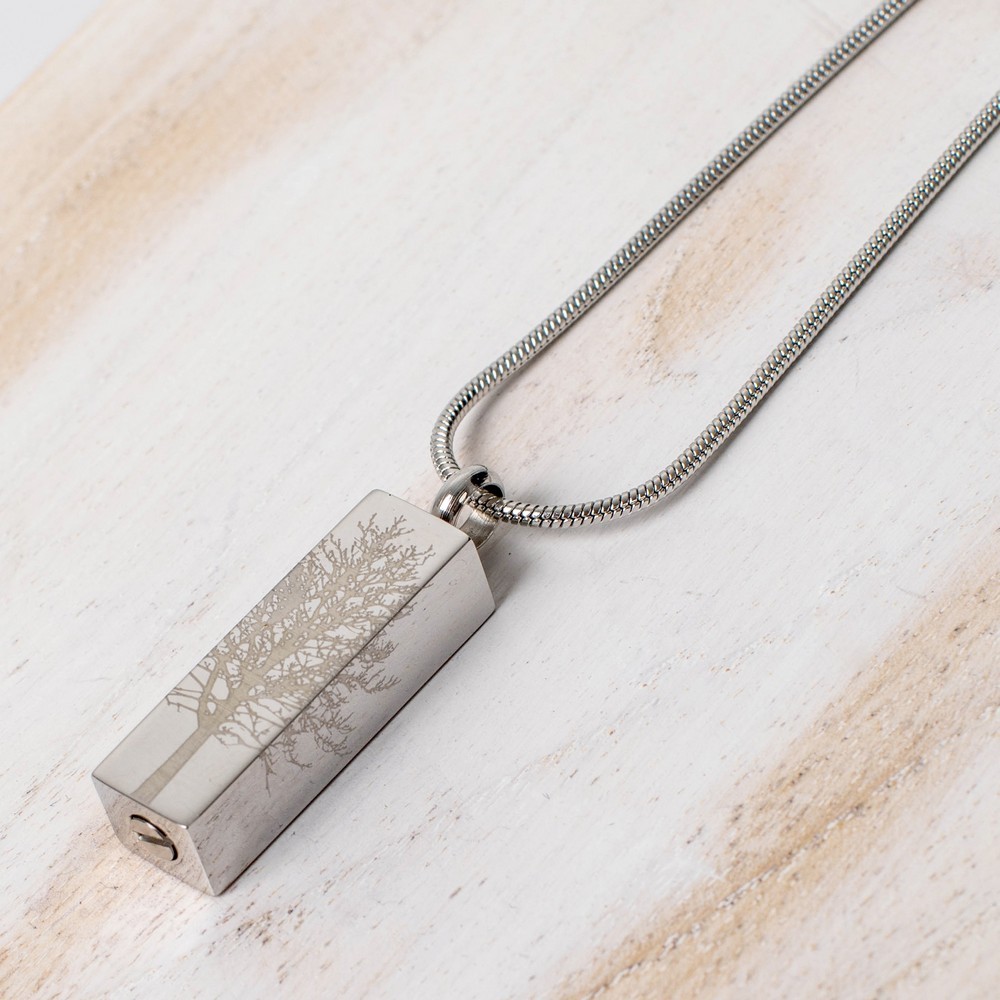 Cremation Jewell Tree Root Pendant from Etternal Funeral Art, silver rectangular pendant on a chain with a tree-root engraving.