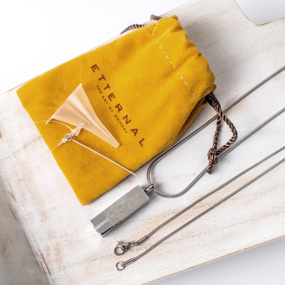 Cremation Jewell Tree Root Pendant presented with Etternal Funeral Art packaging in a mustard pouch.