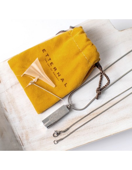 Cremation Jewell Tree Root Pendant presented with Etternal Funeral Art packaging in a mustard pouch.