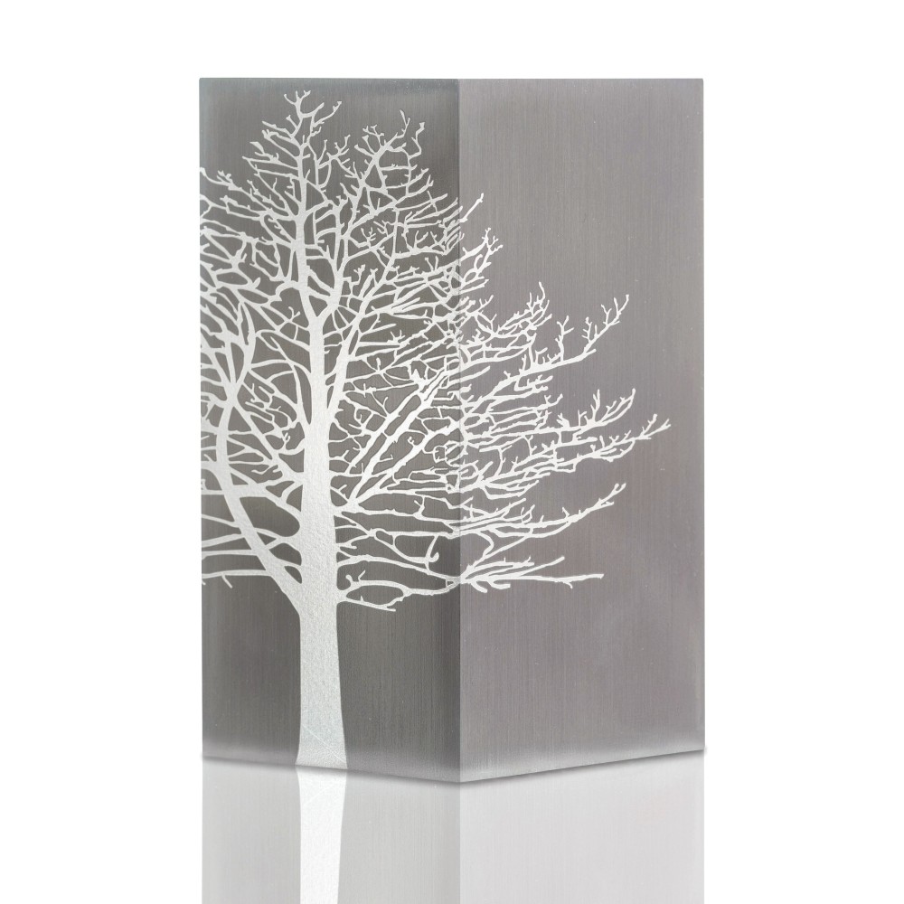 Cremation urn with a silver-gray finish featuring a white tree silhouette design along the side.